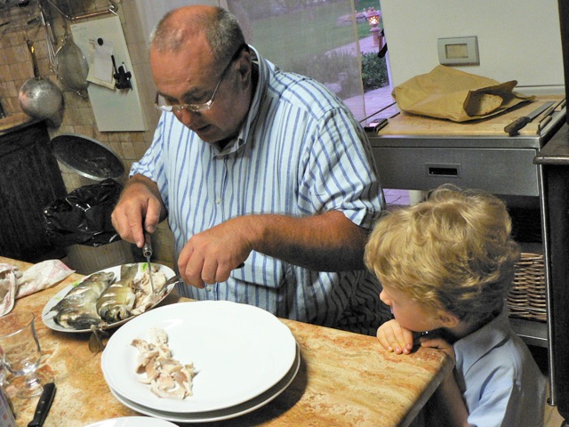 Vittorio -- having taught Nathan how to catch a fish -- now teaches him how to bone one.